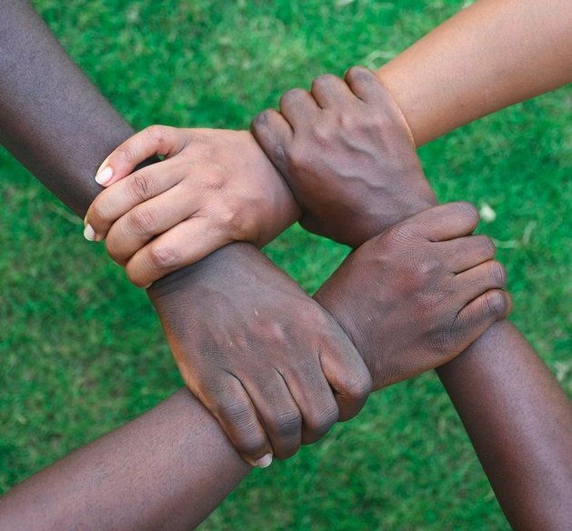a group of hands holding each other